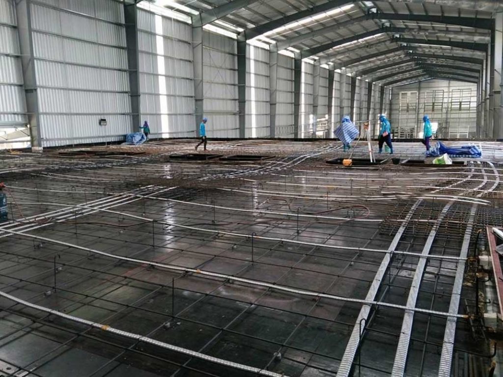 Factory Design and Build floor preparation within a prefabricated steel building
