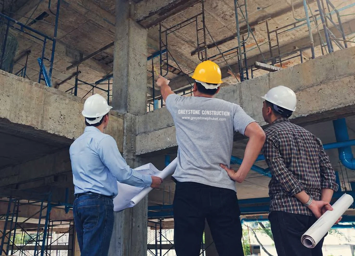 Construction professionals reviewing plans at a project meeting